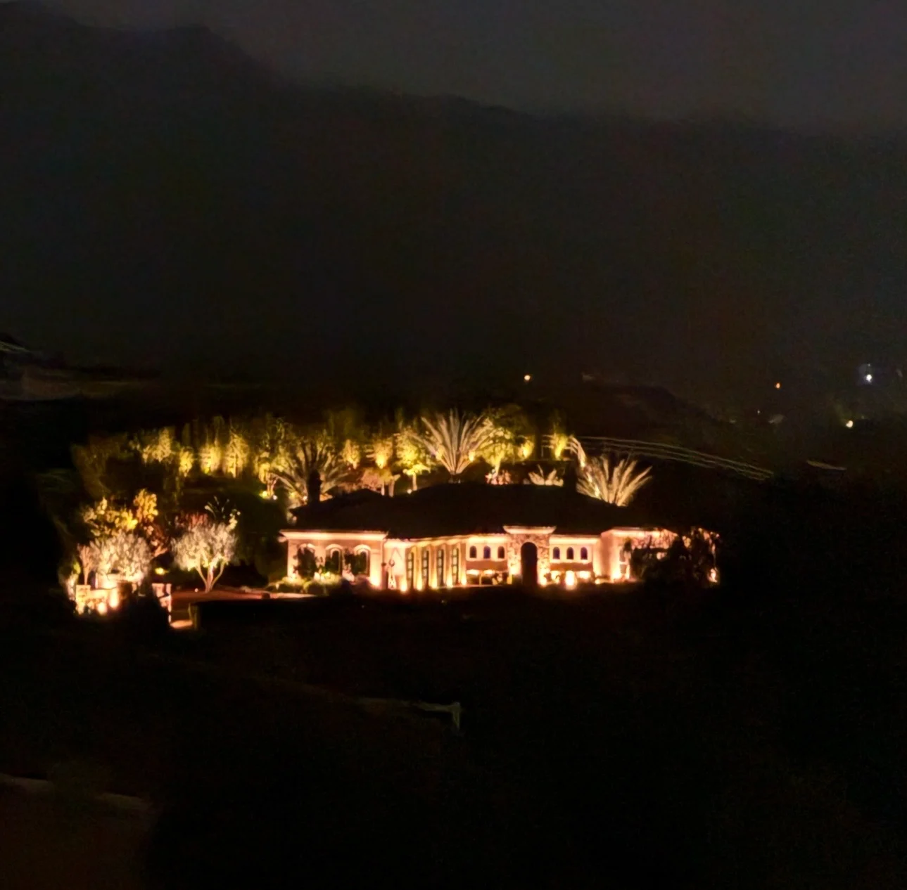 Estate home uplit at dusk in the Temecula Valley