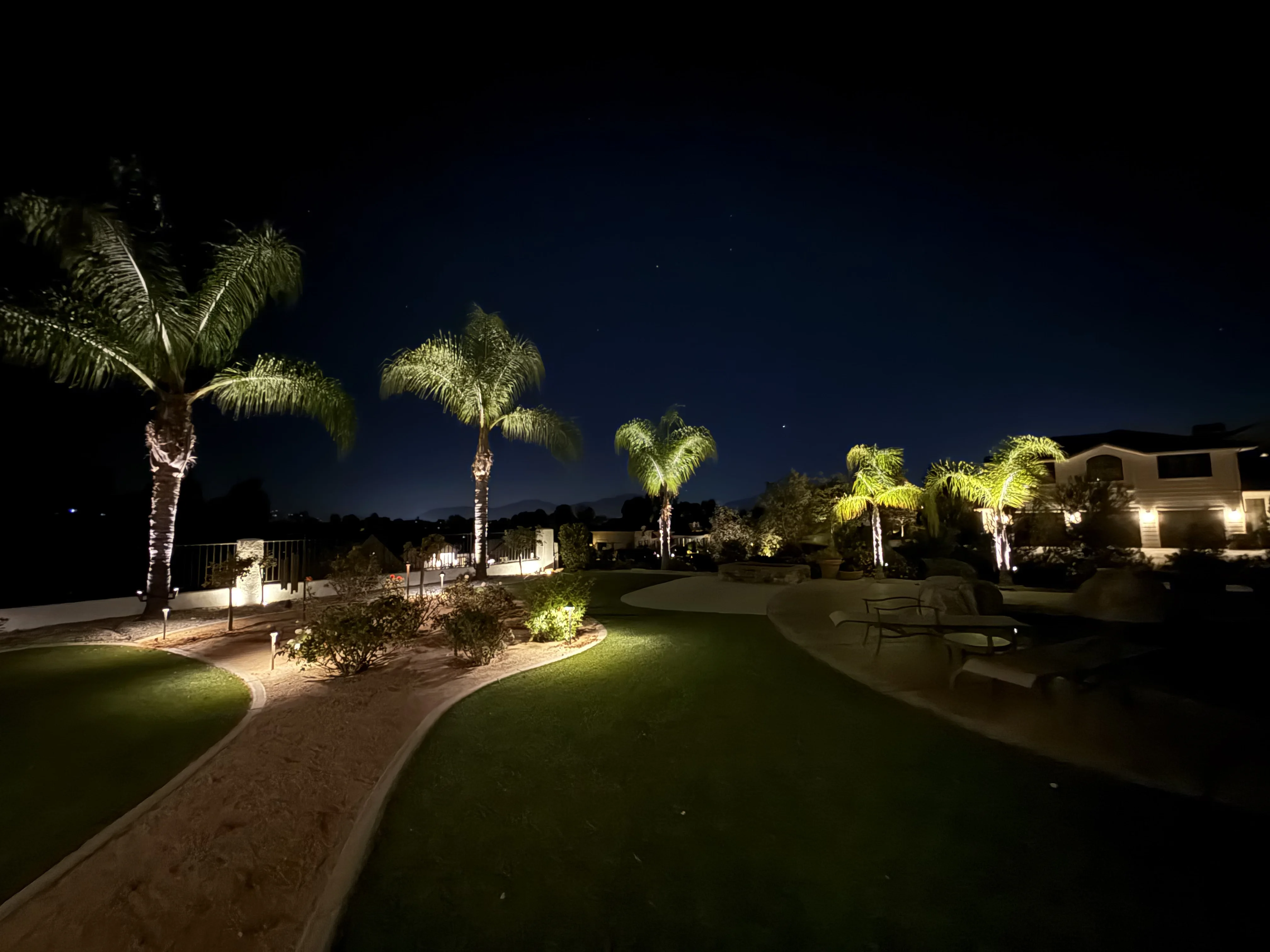 Landscape lighting installation in Temecula at dusk
