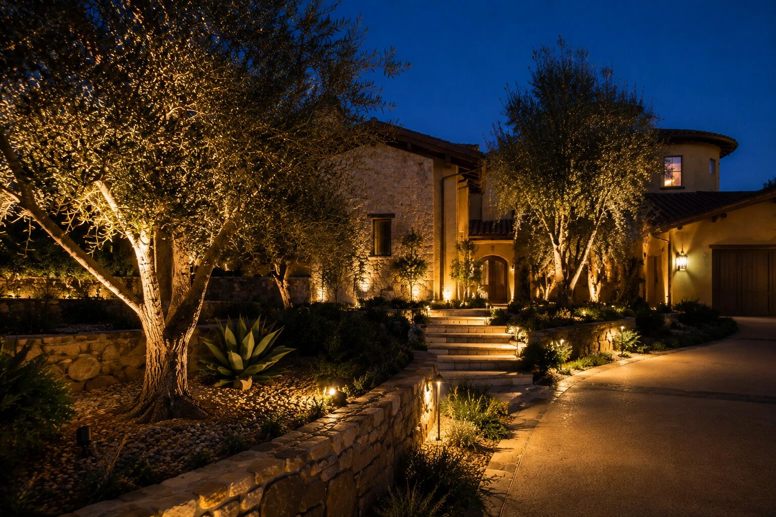 A premium landscape lighting installation at dusk